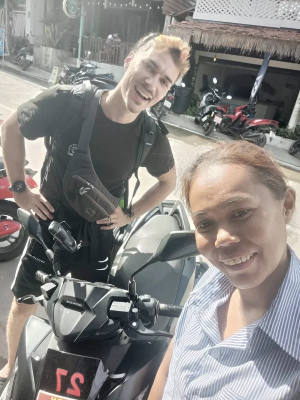 Ireen handing over a Honda scooter